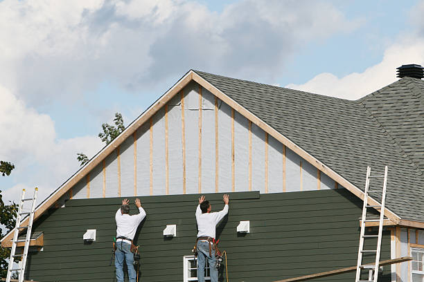 Professional Storm Damage Siding Repair technician working in New Berlin, IL
